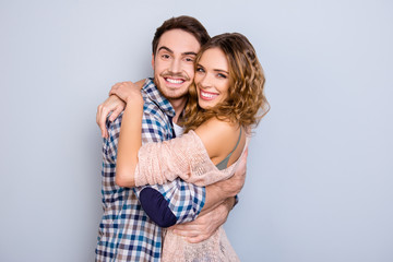 He vs she together forever! Portrait of glad cheerful couple bonding having beaming smiles isolated on grey background