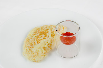 Omelette with red caviar.