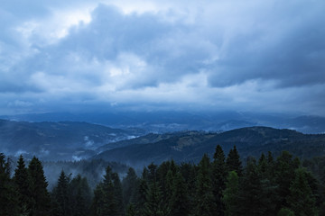 Fototapeta na wymiar view of low mountains on a cloudy day