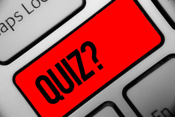 Handwriting text writing Quiz Question. Concept meaning Short Tests Evaluation Examination to quantify your knowledge Keyboard grey key silver laptop computer creative keypad netbook notebook.