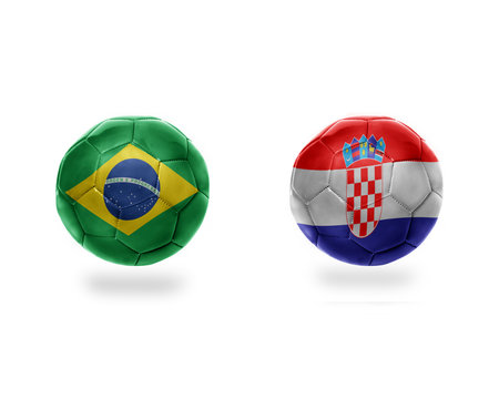 football balls with national flags of brazil and croatia.