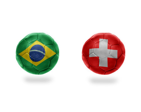 football balls with national flags of brazil and switzerland.