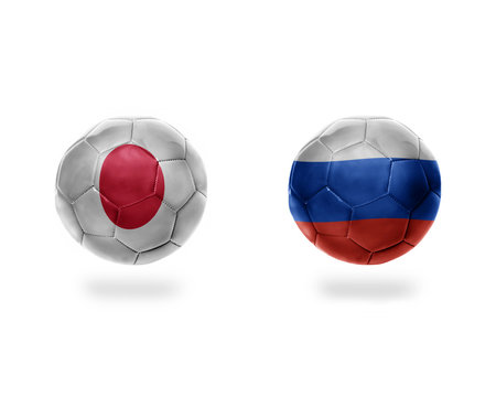football balls with national flags of japan and russia.