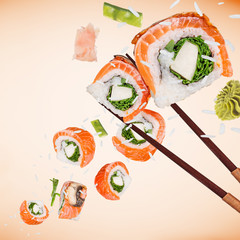 Pieces of delicious japanese sushi frozen in the air.