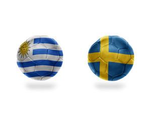 football balls with national flags of uruguay and sweden.