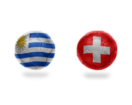 football balls with national flags of uruguay and switzerland.