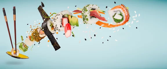 Fotobehang Pieces of delicious japanese sushi frozen in the air. © Lukas Gojda