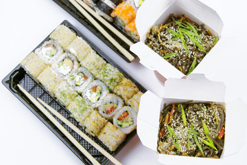 .Delivery of Asian food for dinner. A large plan on a white background.