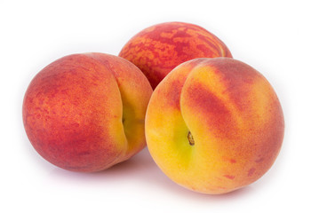 Fresh peaches on white background