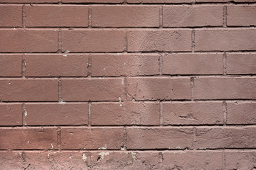 Red smooth brick wall background, terracotta color, close-up.