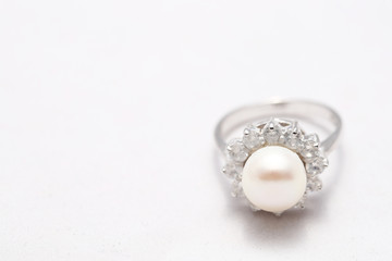 Pearl on diamond ring