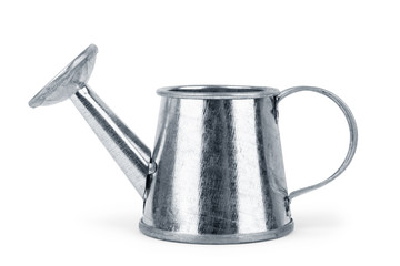 Metal watering can on a white background