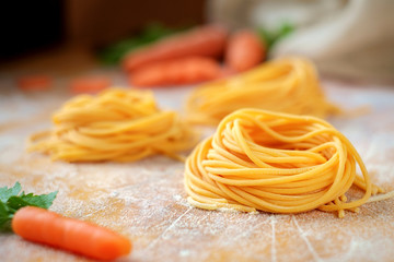 fresh spaghetti nests with carrots