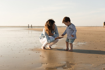 Mother at the beach with toddler