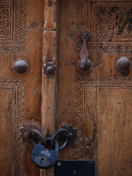 Textured wooden door with metal rivets