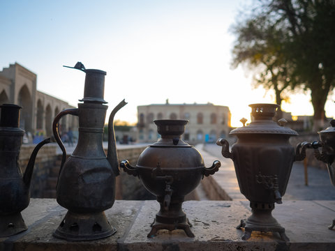 Old metal pots and against cityscape