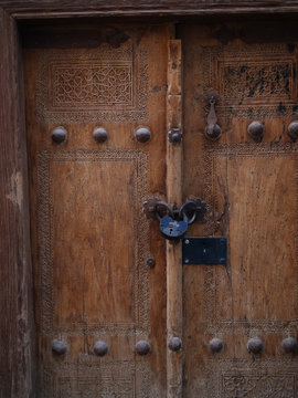 Textured wooden door with metal rivets