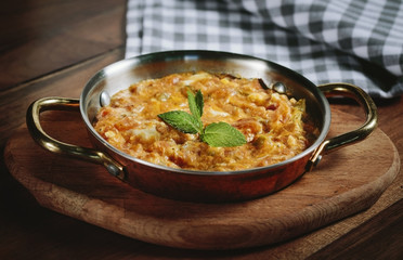 Traditional turkish food menemen made by eggs and tomatoes.