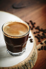 Coffee cup and coffee beans on table