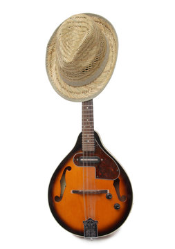 Old hat and mandolin in country style on a white background