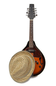 Old hat and mandolin in country style on a white background