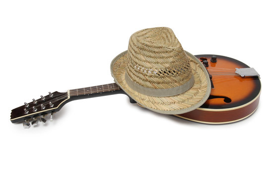 Old hat and mandolin in country style on a white background