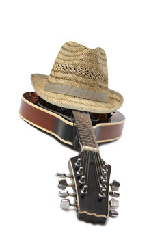Old hat and mandolin in country style on a white background