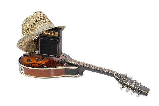 Old hat and mandolin in country style on a white background
