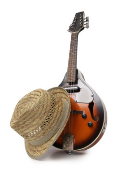 Old hat and mandolin in country style on a white background