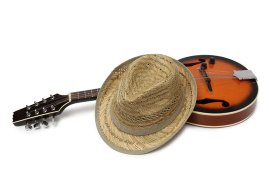 Old hat and mandolin in country style on a white background