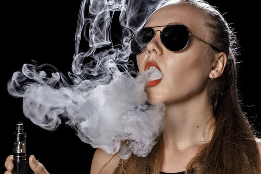 Girl soars on a black background vape