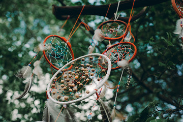 Dream Catcher  with natural background in vintage style. boho chic, ethnic amulet.