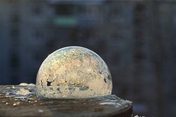 Soap bubbles freeze in the cold. Winter soapy water freezes in t