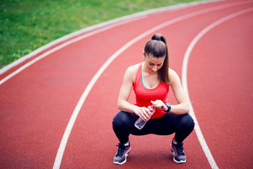 Sporty woman resting after running