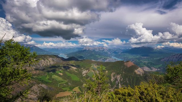 Elevated view on Serre-Poncon Lake, Durance Valley and Ubbaye Valley in Summer (timelapse). Hautes-Alpes, European Alps, France