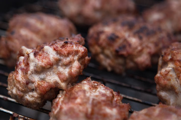 Burger Grilling on Fire. Homemade Hamburgers. Grill Meatballs. Making Hamburgers on a Grill Outdoor. 
