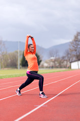 Obraz premium active woman doing stretching before training