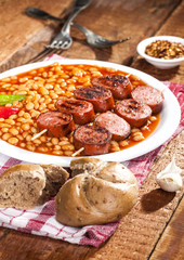 Beans with grilled sausage