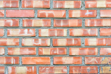 A wall of unusual spotted bricks. Blank background. The texture of the brickwork.