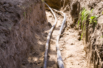 pipes in the construction pit. background, working