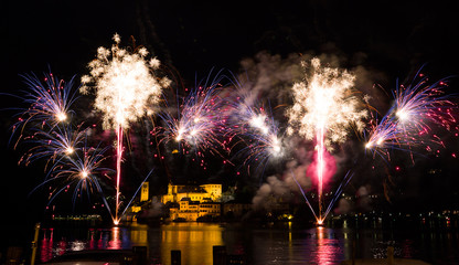 amazing colorful fireworks display on the Orta Lake island. Piedmont,Italy