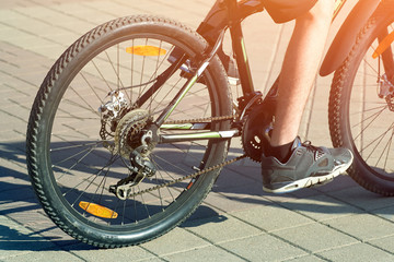 Fototapeta na wymiar Closeup of a bicycle with a bicyclist.