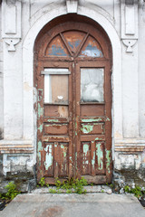 Old ancient painted door with stairs against  background