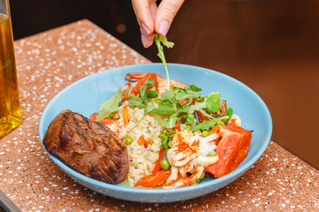 Beef steak with salad rice on a plate