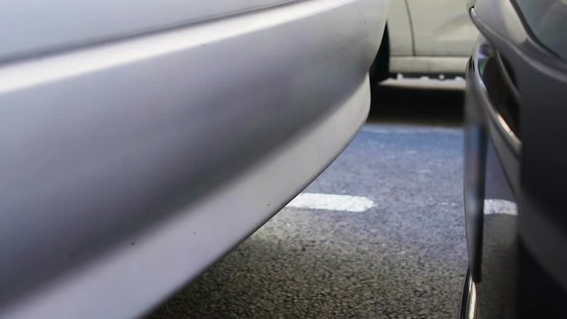 Car accident on nasty day, unsuccessful parking, traffic violation, closeup