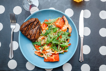 Beef steak with salad rice on a plate