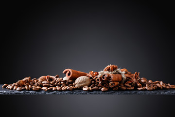 Roasted coffee beans with spices .