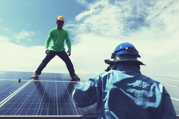 engineer team working on replacement solar panel in solar power plant;engineer and electrician team...