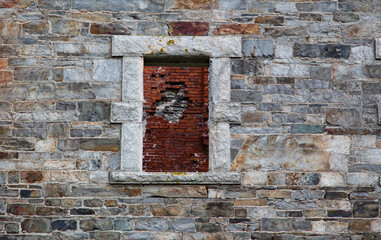 Fototapeta na wymiar Brick wall in stone window