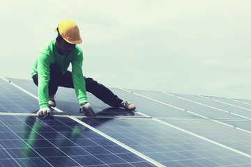 engineer team working on replacement solar panel in solar power plant;engineer and electrician team...